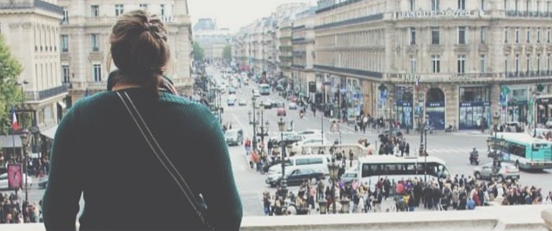 Woman Staring Out into a Busy Street